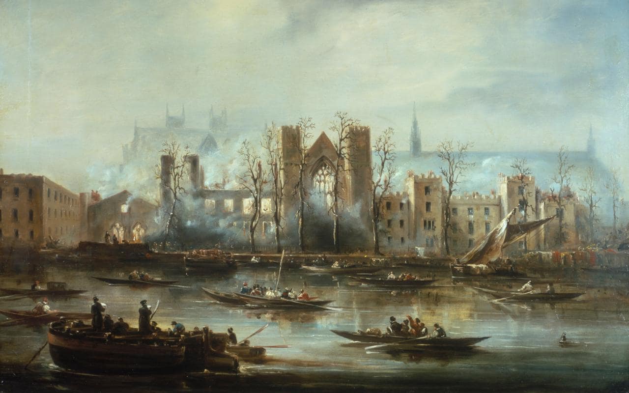 Les ruines fumantes du Palais de Westminster à Londres en 1834.
