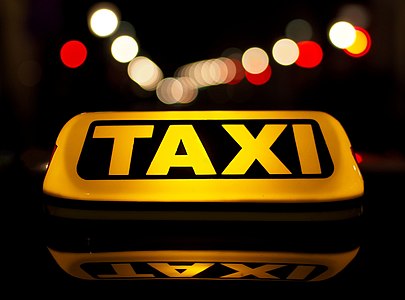 TAXI in night traffic.