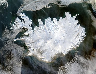 Iceland lives up to its name in this image, acquired by the Moderate Resolution Imaging Spectroradiometer (MODIS) on NASA's Terra satellite on January 28, 2004. The island country is completely covered in white snow and ice, obscuring the permanent glaciers and icecaps that exist year-round. The effect of ice on this island sandwiched between the North Atlantic and the Greenland Sea, just below the Arctic Circle, is visible along its rugged northern shores. Over millennia, ice has carved out deep fjords leaving fringes of land that extend like fingers into the ocean.