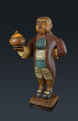 Fridolin, an important family member. 65 cm tall, made of wood, indonesian origin.