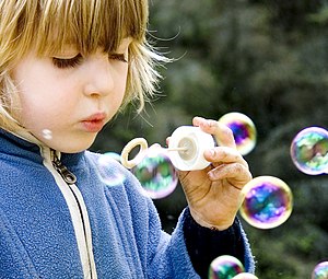 Girl blowing bubbles