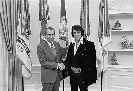 Elvis Presley meeting Richard Nixon. On December 21, 1970, at his own request, Presley met then-President Richard Nixon in the Oval Office of The White House. Elvis is on the right. Waggishly, this picture is said to be 'of the two greatest recording artists of the 20th century'. The Nixon Library & Birthplace sells a number of souvenir items with this photo and the caption, "The President & the King."