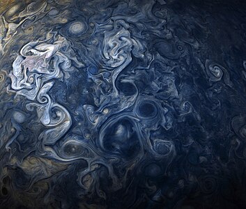 See Jovian clouds in striking shades of blue in this new view taken by NASA’s Juno spacecraft.