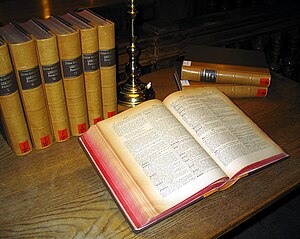 a multi volume Latin dictionary on a library table