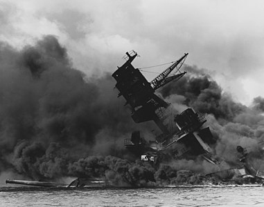 The USS Arizona (BB-39) burning after the Japanese attack on Pearl Harbor, 7 December 1941. USS Arizona sunk at en:Pearl Harbor. The ship is resting on the harbor bottom. The supporting structure of the forward tripod mast has collapsed after the forward magazine exploded.