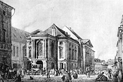 Prager Ständetheater von Vinz. Morstadt, ehemals Nationaltheater des Grafen Nostitz. Links: Carolinum, rechts: im Hintergrund Obstmark. Um 1830. Lav. Sepiazeichnung. (Quelle: Wikimedia)